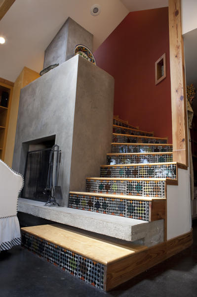 Stairway wrapped around thermal fireplace