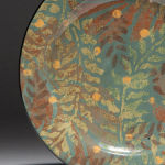 Falling Leaves . Available in 8 and 12 inch plates or 10 inch bowl. Shown with Sage background, also available with olive or black background.